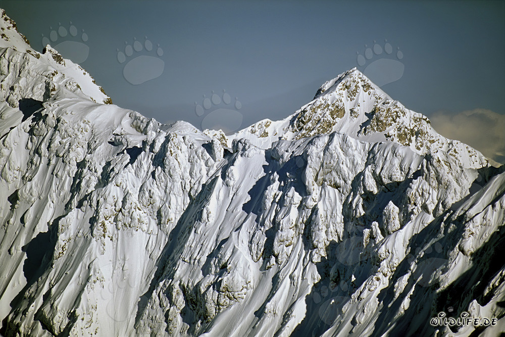 Magical winter landscape in the Karwendel Mountains with snow-covered peaks and deep blue sky