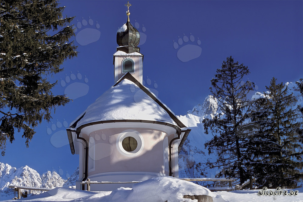 Romantic Christmas Chapel in the Snowy Mountains of Bavaria