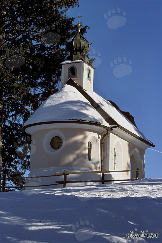 Romantic Christmas Chapel in the Snowy Mountains of Bavaria