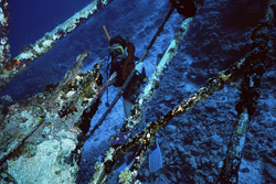 Rusty wreck off the coast of Bandos in the Republic of Maldives in the deep Indian Ocean