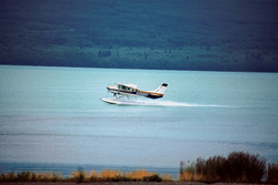 Spectacular takeoff of a water plane in the remote wilderness areas of Alaska