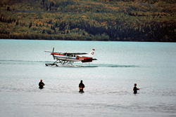 Fascinating image of a bush plane and a fisherman in the wilderness of Alaska