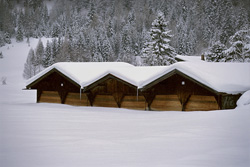 Romantic winter idyll with snow-covered hay barn in Mittenwald, Bavaria
