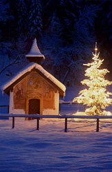 Idyllic Mountain Chapel in Winter Snow in Bavaria, Germany