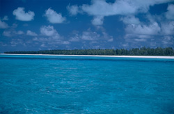 Unique lagoon on Midway Island with fascinating clouds sky