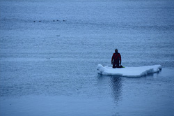 Snorkelers on ice floe at Cape Anne in the Arctic
