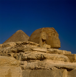 Impressive Great Sphinx of Giza with historic Cheops Pyramid in background