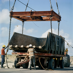 The Manitowoc 4600-the stones were installed at Breakwater. The empty Skip is placed on the platform trailer and brought to the quarry yard for loading.