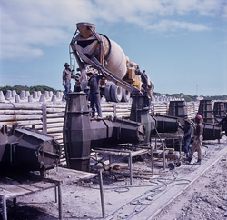 Concrete mixer, chute, and steel formwork - The production of Dolosse in Richards Bay