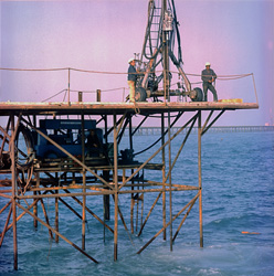 Steel tower with Atlas Copco overlay drilling rig in Shueiba Harbour, Kuwait