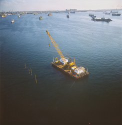 Fascinating use of a crane barge in the quaywall construction in Alexandria