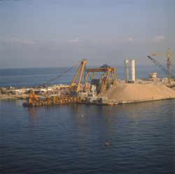 View of the Block Yard with Portal Crane and Transport Pontoon: Construction Works in Ras el Tin Harbor